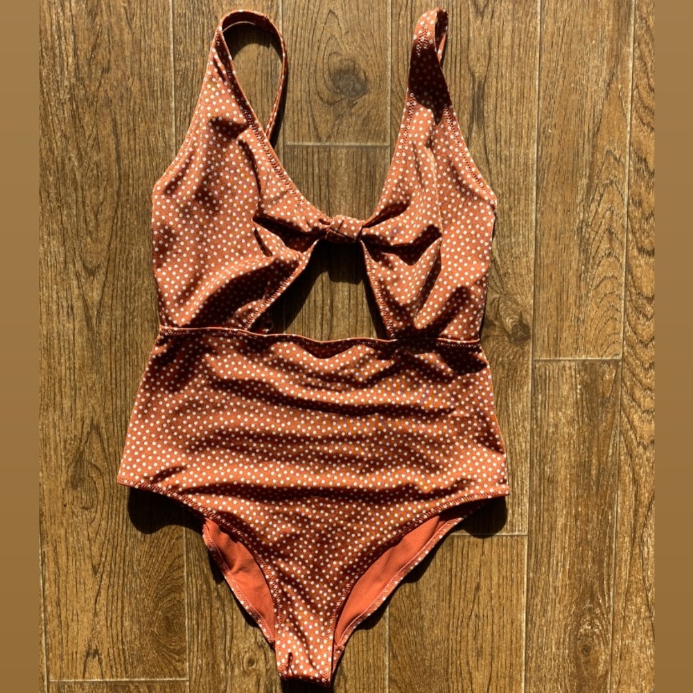 Orange and white polka dot one piece swimsuit
